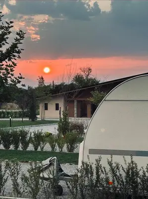 a view of a sunset from the back of a tent at 7 Lakes camping in Sapareva Banya