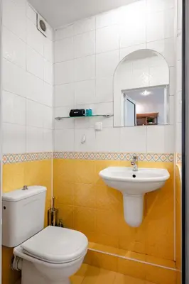 a bathroom with a toilet and a sink at Charming Studio on Vitosha Street by Flat Mаnager in Sofia