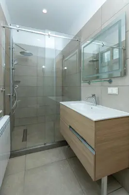 a bathroom with a sink and a glass shower at Луксозни студия “Старият Батак” / Luxury studios “The Old Batak” in Batak