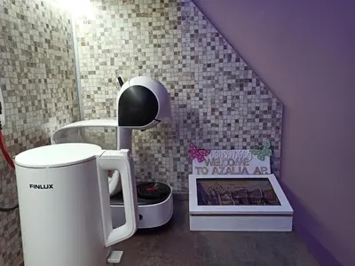 a small bathroom with a table and a coffee maker at Azalia Sandanski in Sandanski