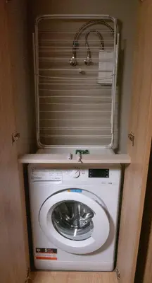 a washer and dryer with a shelf on top of it at Луксозно студио One Place in Sofia A1 - Лозенец in Sofia