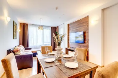 a dining room with a table and chairs at Oak Residence Hotel & Relax in Smolyan