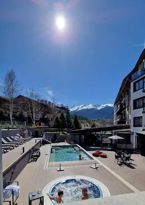 a large swimming pool with people in it at St Ivan Rilski Spa Luxury apartment Bansko & Free SPA in Bansko