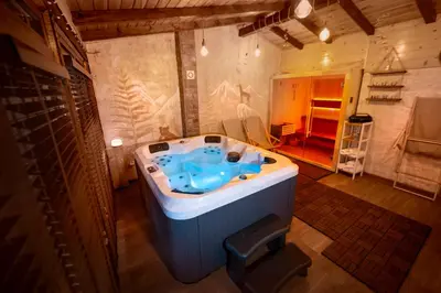 a large bathroom with a blue tub in a room at ВИЛА Belle Vie in Beli Iskar