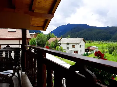 a balcony with a view of a mountain at ВИЛА Belle Vie in Beli Iskar