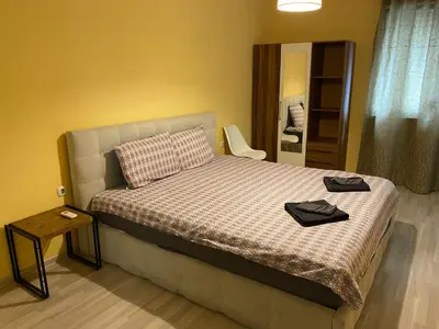a bedroom with a bed with two hats on it at Modern & Central 1BR Apartment with lovely terrace in Plovdiv