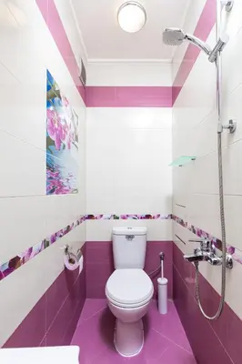 a purple bathroom with a toilet and a shower at The Cozy Home 1-Bedroom in Central Plovdiv by Flat Mаnager in Plovdiv