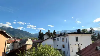 a view of a town with mountains in the background at Kaloyanova House Bansko in Bansko