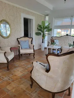 a living room with two chairs and a couch at Белият кът in Sapareva Banya