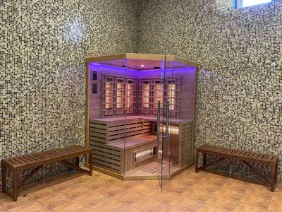 a glass room with two benches in a room at Boho Mountain Studio in Smolyan