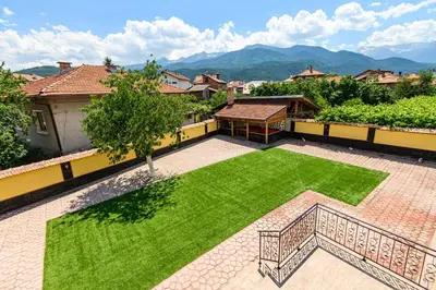 an aerial view of a yard with green grass at Guest House Dinaya in Dobrinishte