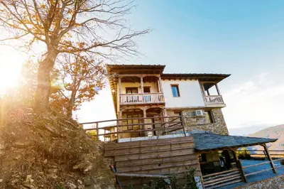 a house on the side of a mountain at Панорама хаус Лещен и еко къщи Дървена и Землянка in Leshten