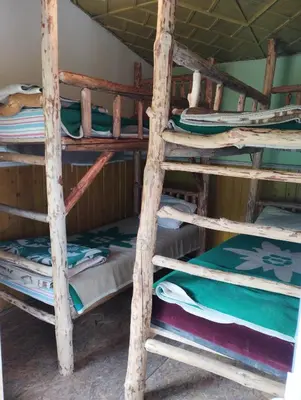 a group of bunk beds in a room at Хижа Ловна в Рила in Panichishte