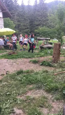 a group of children are standing in a field at Хижа Ловна в Рила in Panichishte