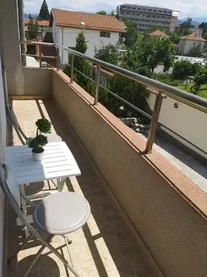 a balcony with a table and chair on a balcony at Angel&MAR in Velingrad