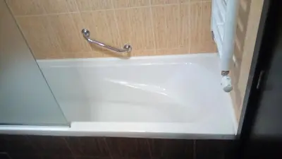 a white bath tub in a bathroom with a shower curtain at Alexander 3327 in Bansko
