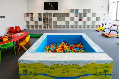 a large pool of balls in a room with a table at Uva Nestum Wine & SPA in Gotse Delchev