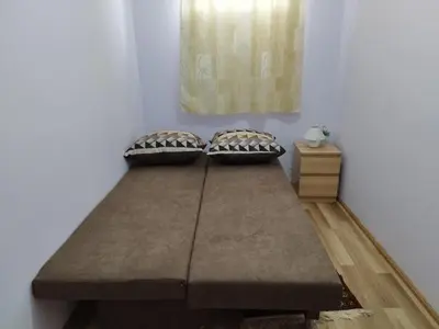a bed in a room with two pillows on it at Villa Bella - A Rila Monastery Adventure in Kocherinovo