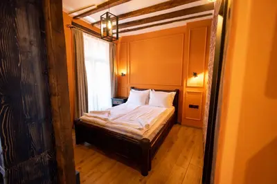 a small bed in a room with a window at NOMAD STUDIOS, Kapana in Plovdiv