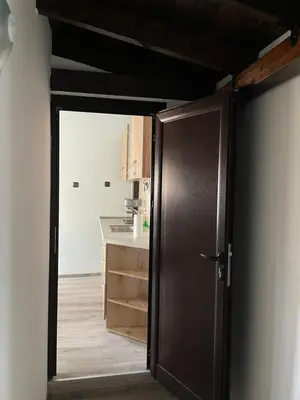 an open door to a kitchen with a counter at Apart Uzunov-3 in Hisarya