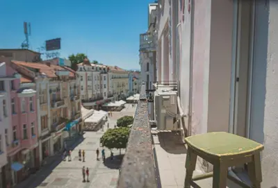 a view of a city street from a balcony at Temple House in Plovdiv