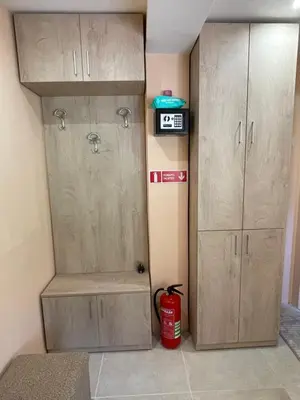 a room with two wooden cabinets at Св.Георги in Sapareva Banya