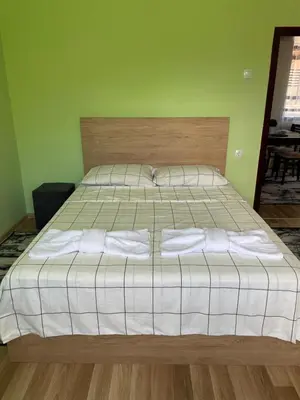 a bedroom with a bed with two pillows on it at Св.Георги in Sapareva Banya