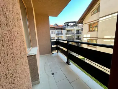 a balcony with a view of a building at Private Apartments next to Bellevue Residence in Bansko