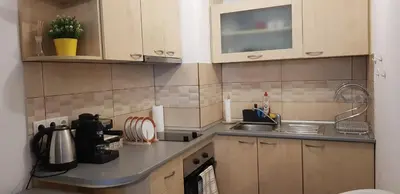 a kitchen with a sink and a counter top at Karastoyanovi's apartment 2 in Sofia