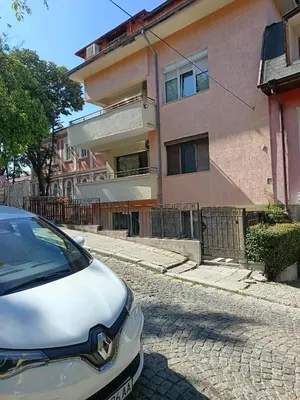 a white car parked in front of a building at The hiils 4 Plovdiv in Plovdiv
