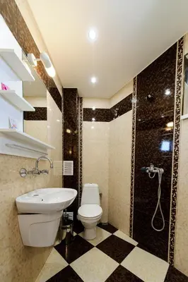 a bathroom with a toilet and a sink and a shower at Sandanski Peak Guest Rooms in Sandanski