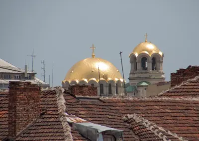 two gold domes on top of roofs with a church at Lovely 1-bedroom apartment in the center of Sofia in Sofia