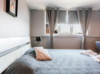 a bedroom with a bed and a window at Lovely 1-bedroom apartment in the center of Sofia in Sofia
