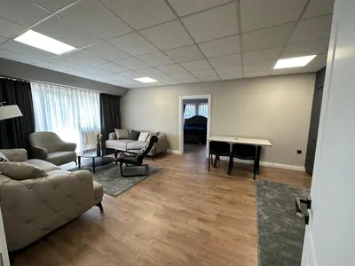 a living room with a couch and a table at Apartaments Filipopolis in Plovdiv