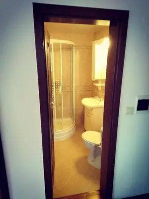 a bathroom with a toilet and a shower at GD Apartament in Bansko
