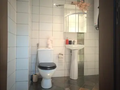 a bathroom with a toilet and a sink at ParkView Complex Large Flat Next to Ski Lift in Bansko