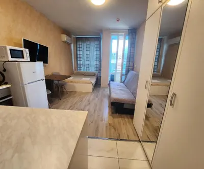 a small kitchen and living room with a white refrigerator at Colonel apartment 944 in Sofia