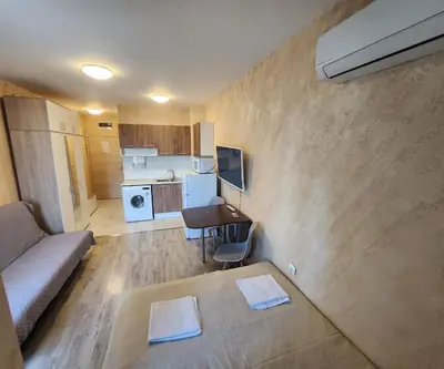 a living room with a couch and a table at Colonel apartment 944 in Sofia