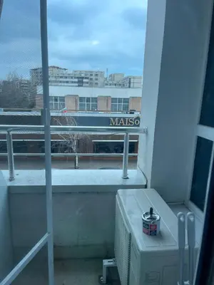 a balcony with a view of a train on the tracks at Colonel apartment 945 in Sofia