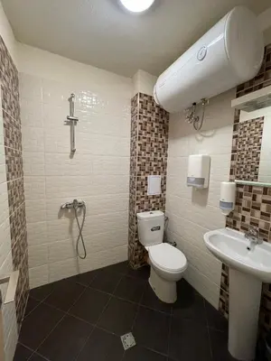 a bathroom with a toilet and a sink at Colonel apartment 945 in Sofia