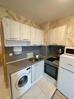 a kitchen with a washing machine and a sink at Colonel apartment 946 in Sofia