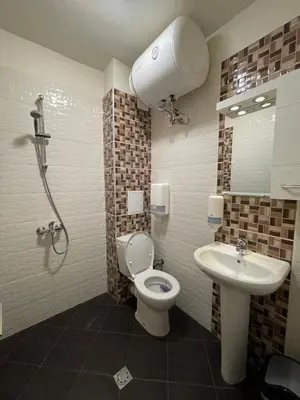a bathroom with a shower and a toilet and a sink at Colonel apartment 947 in Sofia
