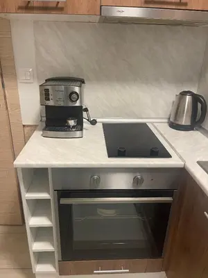 a kitchen counter with a coffee maker on a counter top at Colonel apartment 958 in Sofia