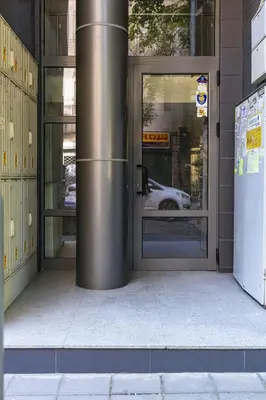 an entrance to a building with a revolving door at Stylish 2BD Apartment with a Nice Cozy Terrace by Flat Mаnager in Plovdiv