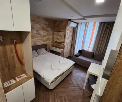 a small room with a bed and a couch at Colonel apartment Luxury in Sofia