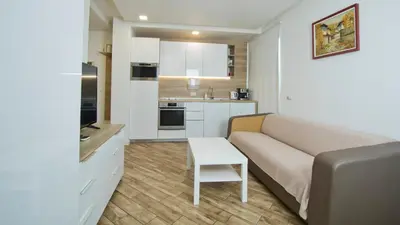 a living room with a couch and a table at Colonel apartment dream in Sofia