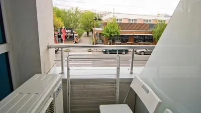 a balcony with stairs and a view of a street at Colonel apartment Bijou in Sofia