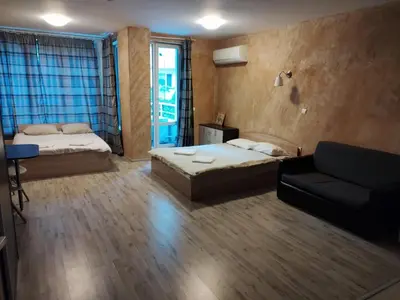 a living room with two beds and a couch at Colonel apartment 957 in Sofia