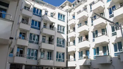 a facade of an apartment building with blue windows at Colonel apartment Relax in Sofia