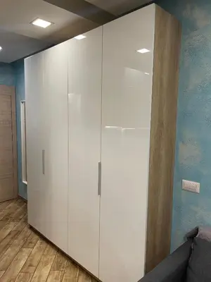 a white cabinet in a room with a couch at Colonel apartment Select in Sofia